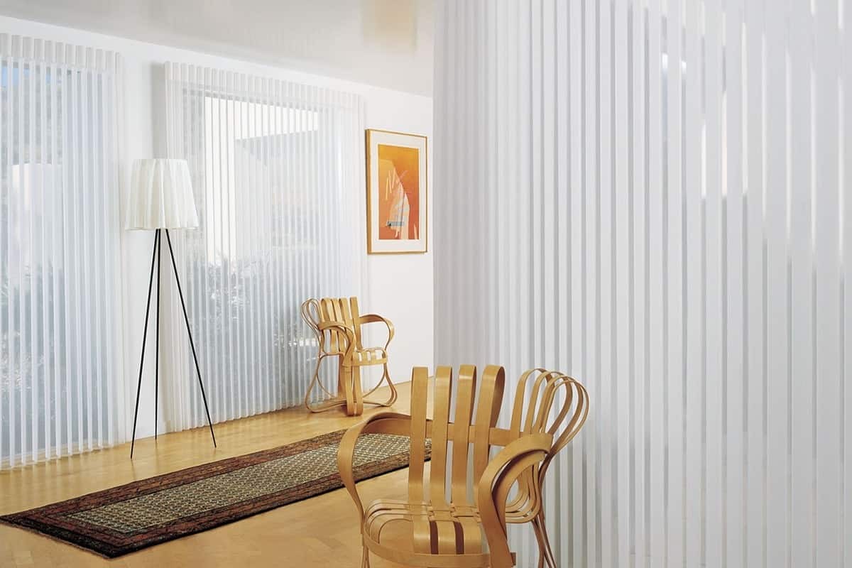 Hunter Douglas Luminette® Privacy Sheers as window coverings and side panels in a living room