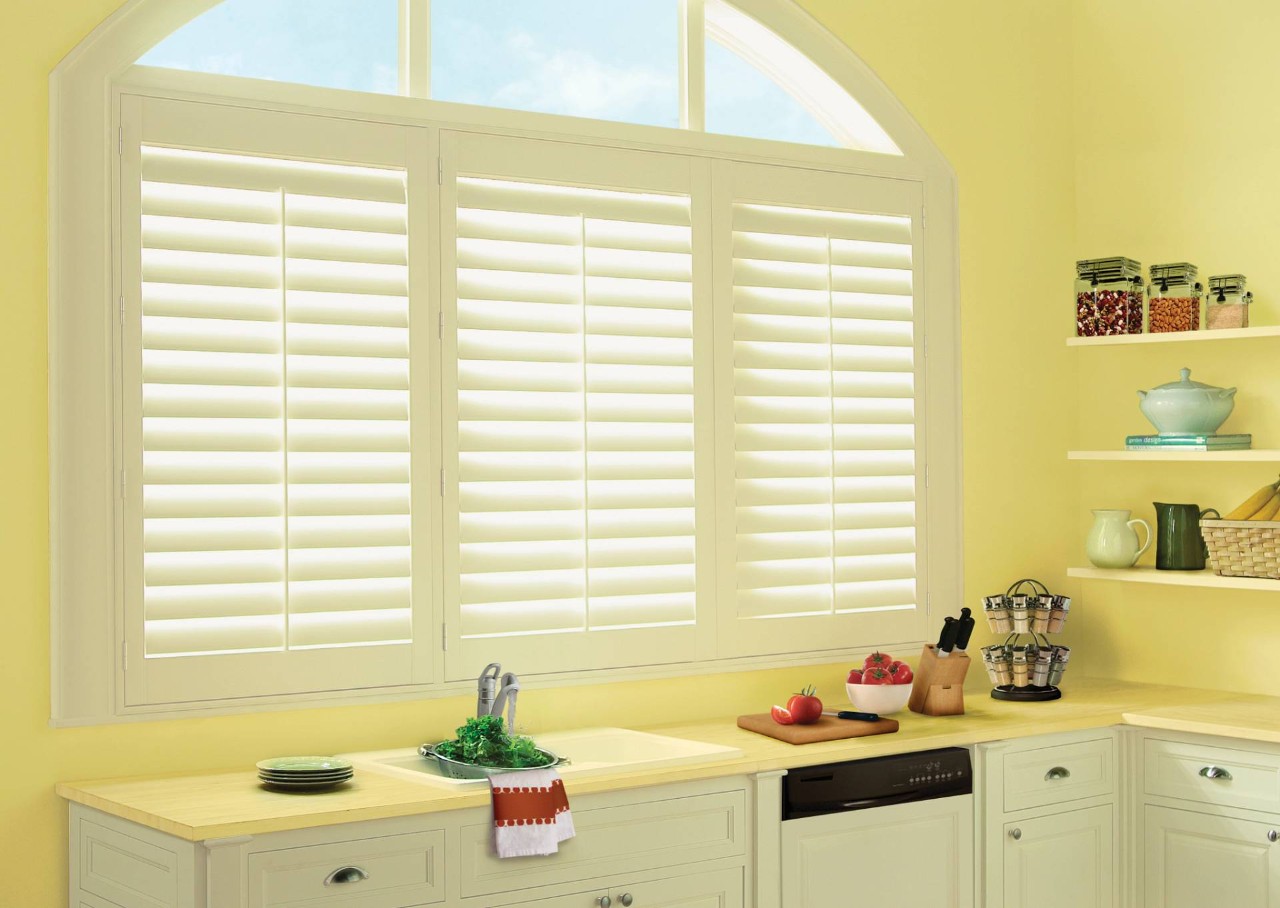 Hunter Douglas Palm Beach™ Polysatin™ Shutters Above a Kitchen Sink near Amarillo, TX